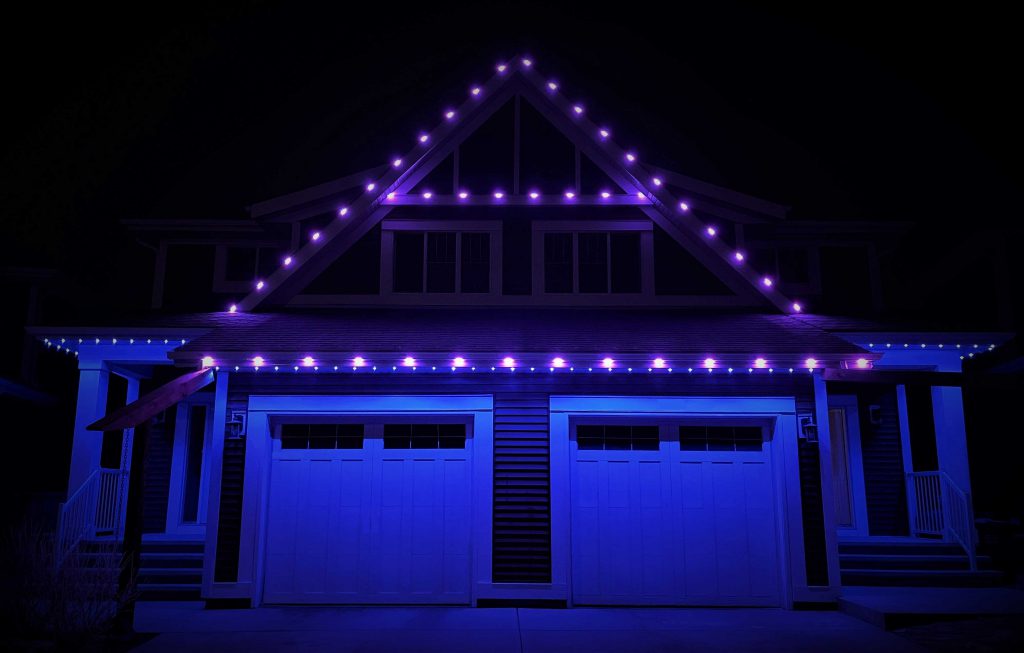 House with outdoor permanent lights blue